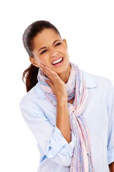 Dental, toothache and oral hygiene with a black woman in studio isolated on a white background at the dentist. Teeth, gums and cavity with a female holding her jaw on blank space from tooth decay.