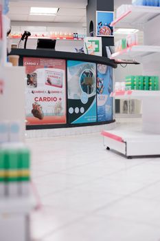 Empty pharmacy store with medicaments and treatment on shelves, used by customers to buy healthcare vitamins and pharmaceutical products. Drugstore with supplements, medication and pills.