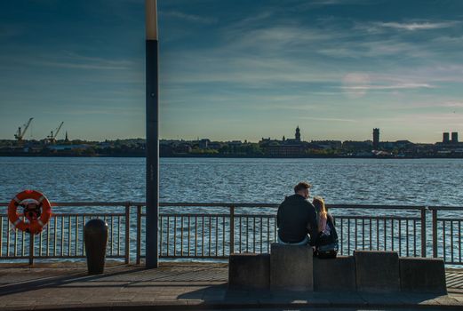 LIVERPOOL UK - May 13, 2019 - A Couple of lovers at the River Mersey, Royal Albert Dock, Liverpool
