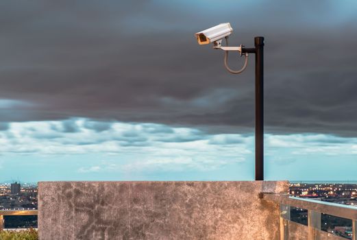 Modern surveillance camera on the sky background. the concept of surveillance and visual inspection that has been developed. copy space. Selective focus.