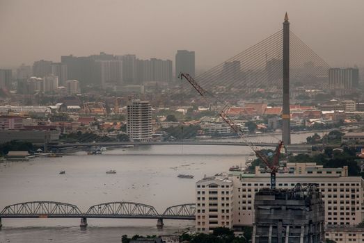 Bangkok, Thailand - Oct 05, 2019 : Beautiful view of Bangkok city, Beauty skyscrapers along Chaopraya river in the afternoon, making the city modern style.