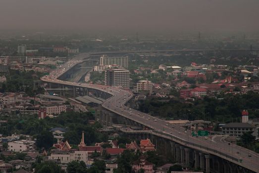 Bangkok, Thailand - Oct 05, 2019 : Aerial view of cars driving on highway junctions. Bridge roads with green garden and trees in connection of architecture concept. Top view. Urban city.