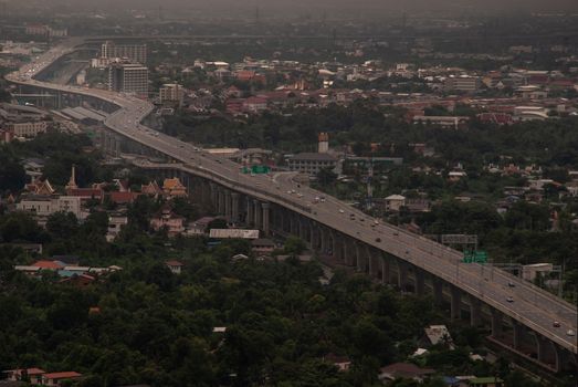 Bangkok, Thailand - Oct 05, 2019 : Aerial view of cars driving on highway junctions. Bridge roads with green garden and trees in connection of architecture concept. Top view. Urban city.