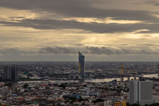 Beautiful city view of Bangkok Before the rain at sunset creates relaxing feeling for the rest of the day. Selective focus.
