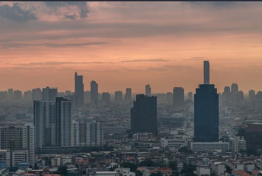 Bangkok downtown cityscape with skyscrapers at evening give the city a modern style. Selective focus.