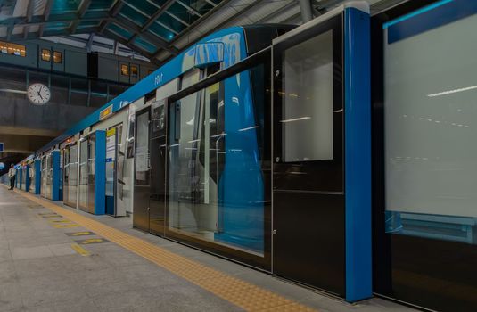 Bangkok, thailand - Sep 18, 2020 :  Inside large modern Tha Phra BTS Skytrain Station of the central business district of Bangkok. The Bangkok Mass Transit System. Selective focus.