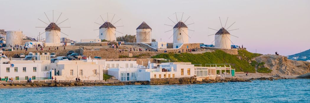 sunset at Mykonos Greek village in Greece, colorful streets of Mikonos village.