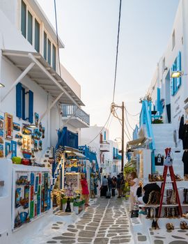 Mykonos Greece April 2018, Tourists at the streets of the Greek village in Greece, colorful streets of Mikonos village.