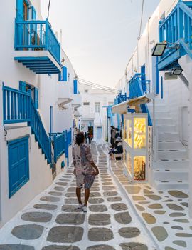 Mykonos Greece April 2018, Tourists at the streets of the Greek village in Greece, colorful streets of Mikonos village.