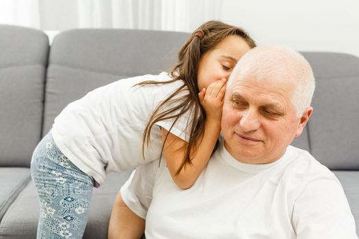 Elderly man his granddaughter