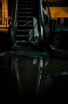 Bangkok, Thailand - 07 Feb 2022 : Damaged escalators and waterlogged in abandoned shopping mall building. Structural and ruins was left to deteriorate over time, New World Mall, Focus and blur.