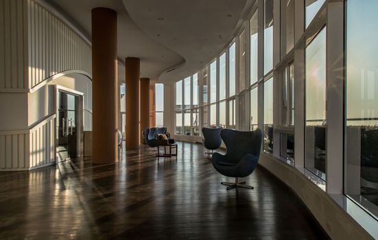 Bangkok, Thailand - Jan 10, 2022 : Common area of condominium in morning. New normal, The seats were set separately according to social distancing policy for the spread of covid-19 prevention, Selective focus.