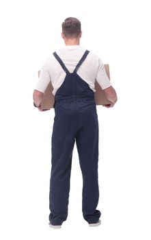 rear view. a young man with a large cardboard box. photo with copy space