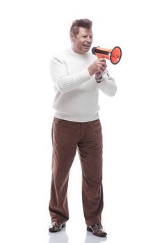 in full growth. smiling handsome man with a megaphone. isolated on a white background