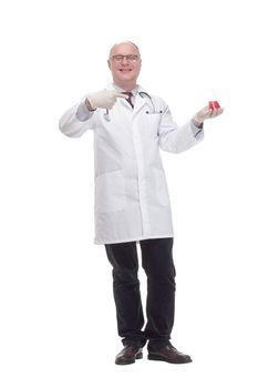 in full growth. qualified mature doctor with laboratory flask. isolated on a white background.
