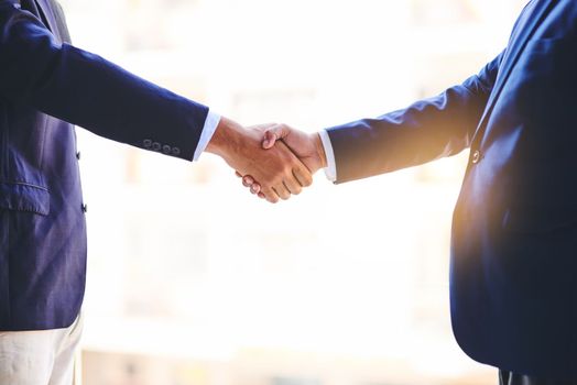 Forming strengthened business relationships. Closeup shot of two unidentifiable businesspeople shaking hands in an office