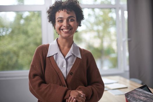 Young mixed race businesswoman smiling to camera