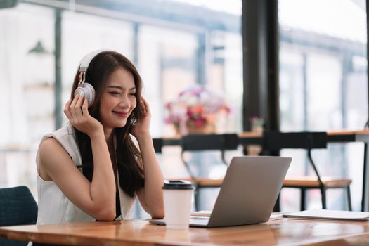 Asian businesswoman in having a video call on laptop at home. business online meeting, online learning at home.