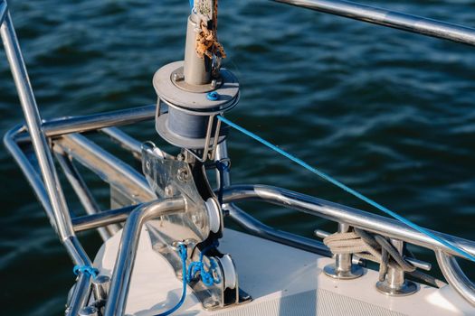 rope on the winch of a white yacht in the sea.yacht equipment.