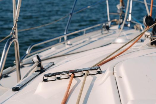 rope on the winch of a white yacht in the sea.yacht equipment.