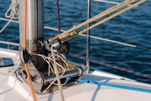 rope on the winch of a white yacht in the sea.yacht equipment.