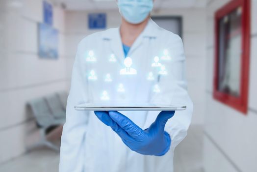 Man In Uniform Standing Holding Tablet Showing Medical Futuristic Tech.