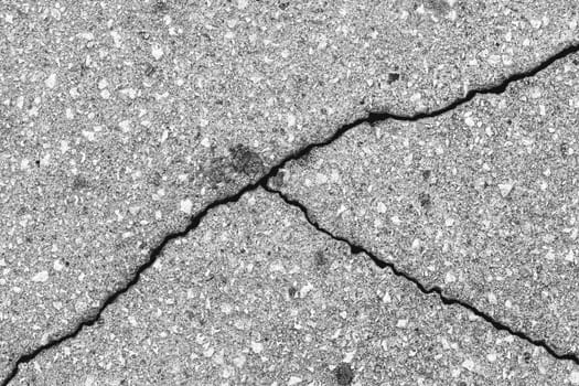 Cracked texture of gray asphalt. Abstract background for design.