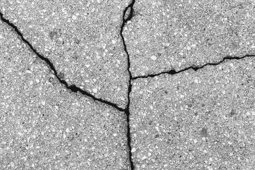 Cracked texture of gray asphalt. Abstract background for design.