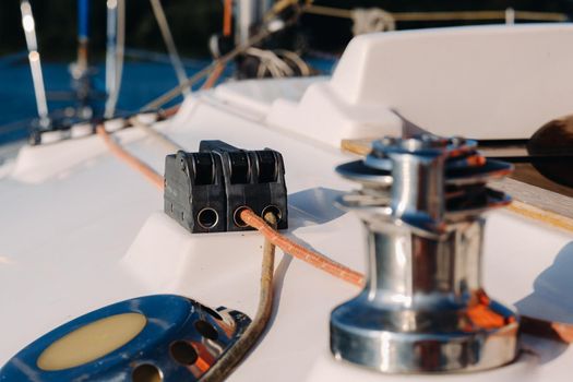 rope on the winch of a white yacht in the sea.yacht equipment.