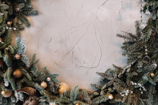 Christmas background with Christmas tree and decoration on light background.