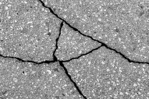 Cracked texture of gray asphalt. Abstract background for design.