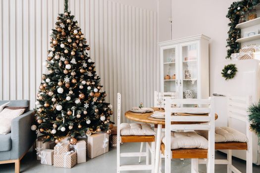 Christmas tree in the home Christmas interior in the kitchen.Decorated Christmas photo zone.