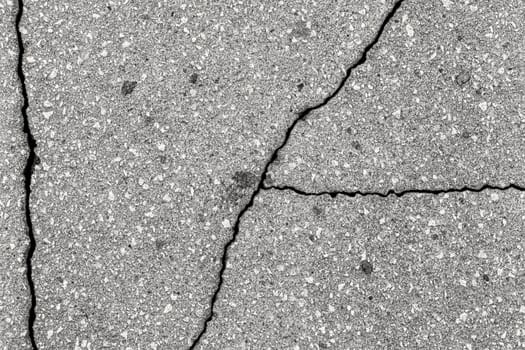 Cracked texture of gray asphalt. Abstract background for design.