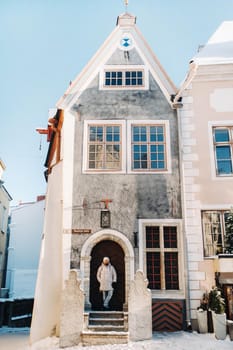 male tourist outdoors in winter in the old town of Tallinn.Estonia