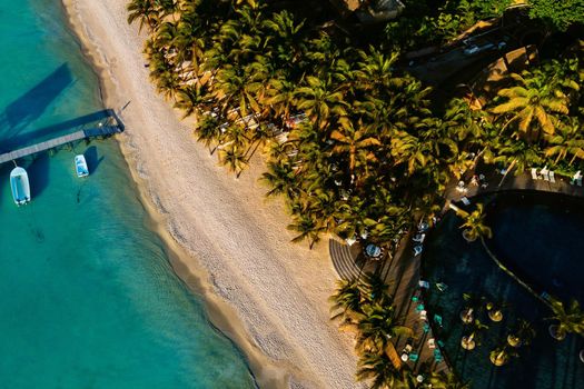 On the beautiful beach of the island of Mauritius along the coast. Shooting from a bird's eye view of the island of Mauritius