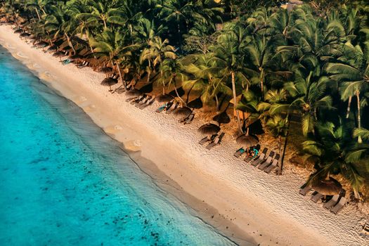 On the beautiful beach of the island of Mauritius along the coast. Shooting from a bird's eye view of the island of Mauritius