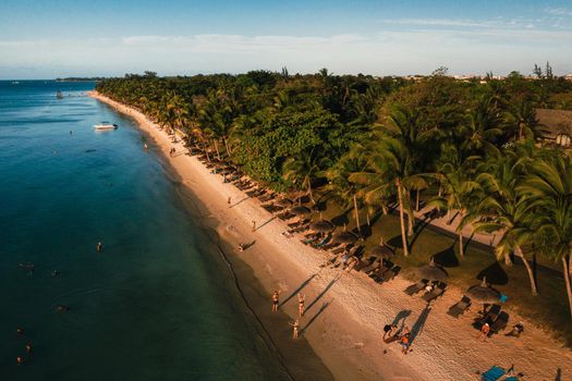 On the beautiful beach of the island of Mauritius along the coast. Shooting from a bird's eye view of the island of Mauritius