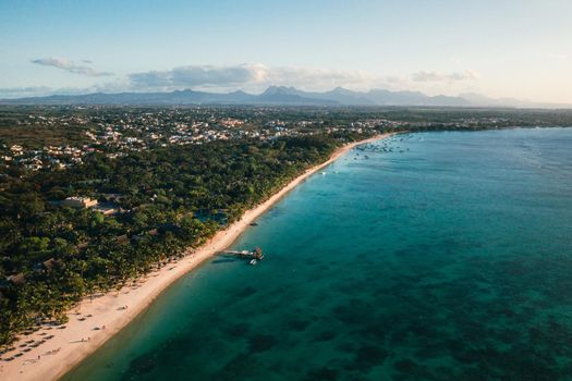 On the beautiful beach of the island of Mauritius along the coast. Shooting from a bird's eye view of the island of Mauritius