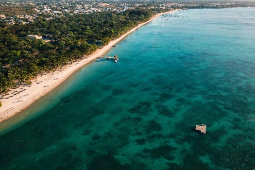 On the beautiful beach of the island of Mauritius along the coast. Shooting from a bird's eye view of the island of Mauritius