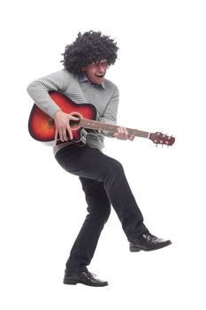 in full growth. cheerful man with a guitar. isolated on a white background.