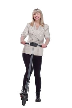 in full growth. smiling adult woman with an electric scooter . isolated on a white background.