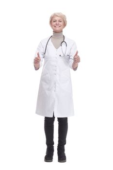 in full growth. smiling woman doctor showing thumbs up. isolated on a white background.
