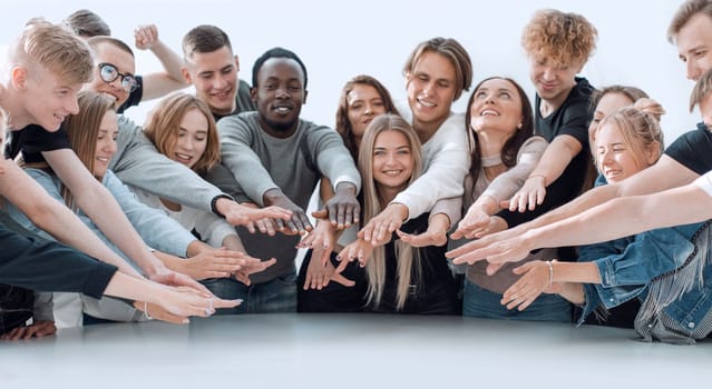 multinational group of young people joining their palms. photo with copy space