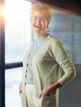 Close up portrait of beautiful senior woman posing at home