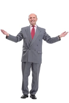 Full length portrait of handsome mature businessman in suit looking at camera isolated on white