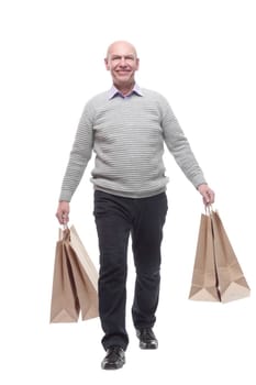 in full growth. happy man with shopping bags. isolated on a white background.