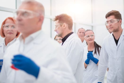 group of researchers working on a new vaccine. concept of health protection.
