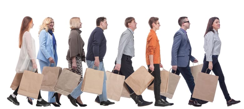 a group of people stand in line with shopping bags. isolated on white