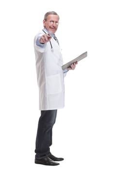 Side view of concentrated male doctor writing reports over white background