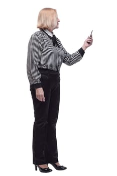in full growth. Executive business woman with a smartphone. isolated on a white background.